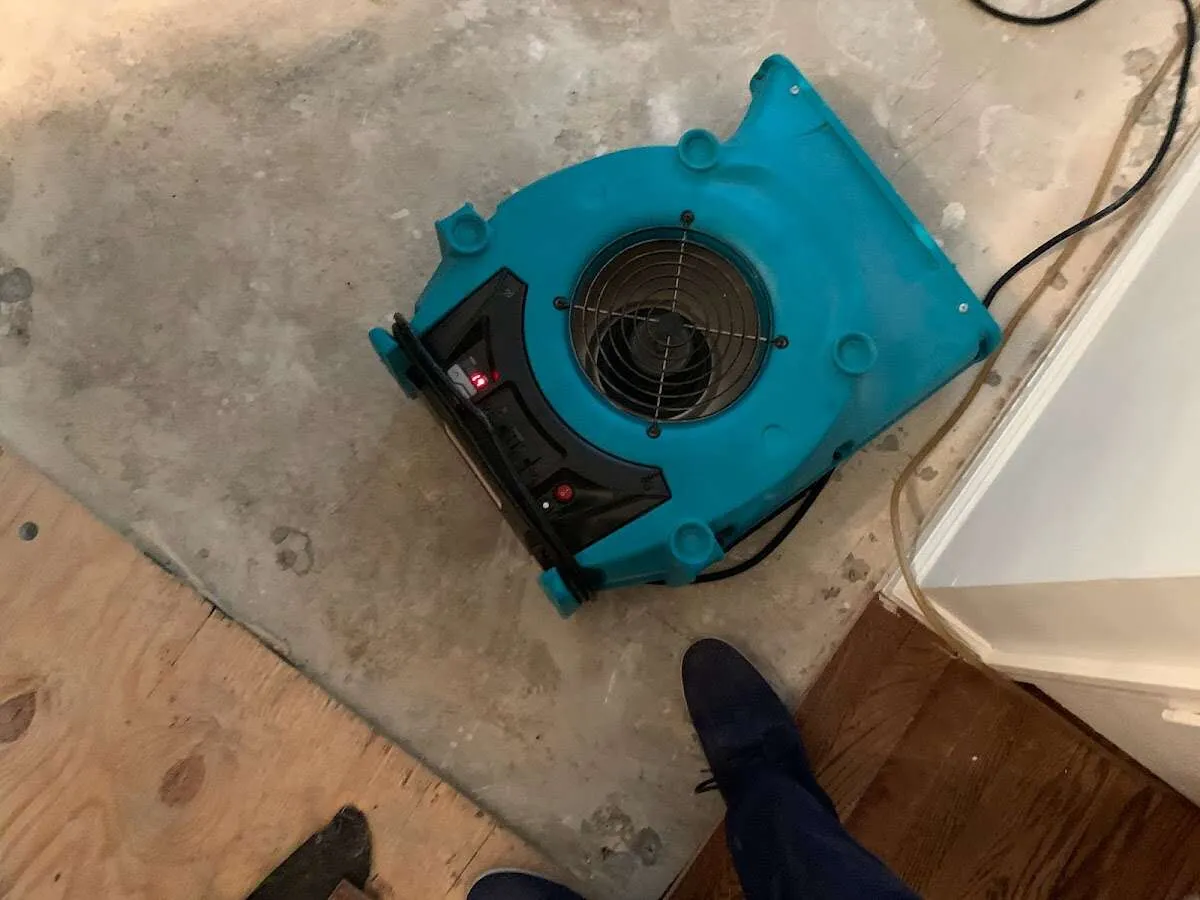 Air mover drying subfloor during Commercial Water Damage Restoration in Cartersville